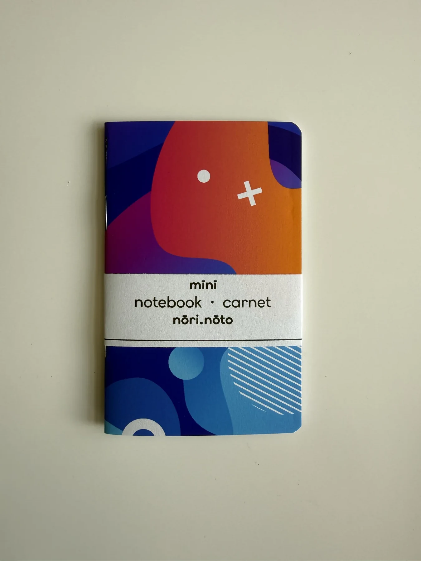 Orange, blue, and pink Mīnī Fankī notebook