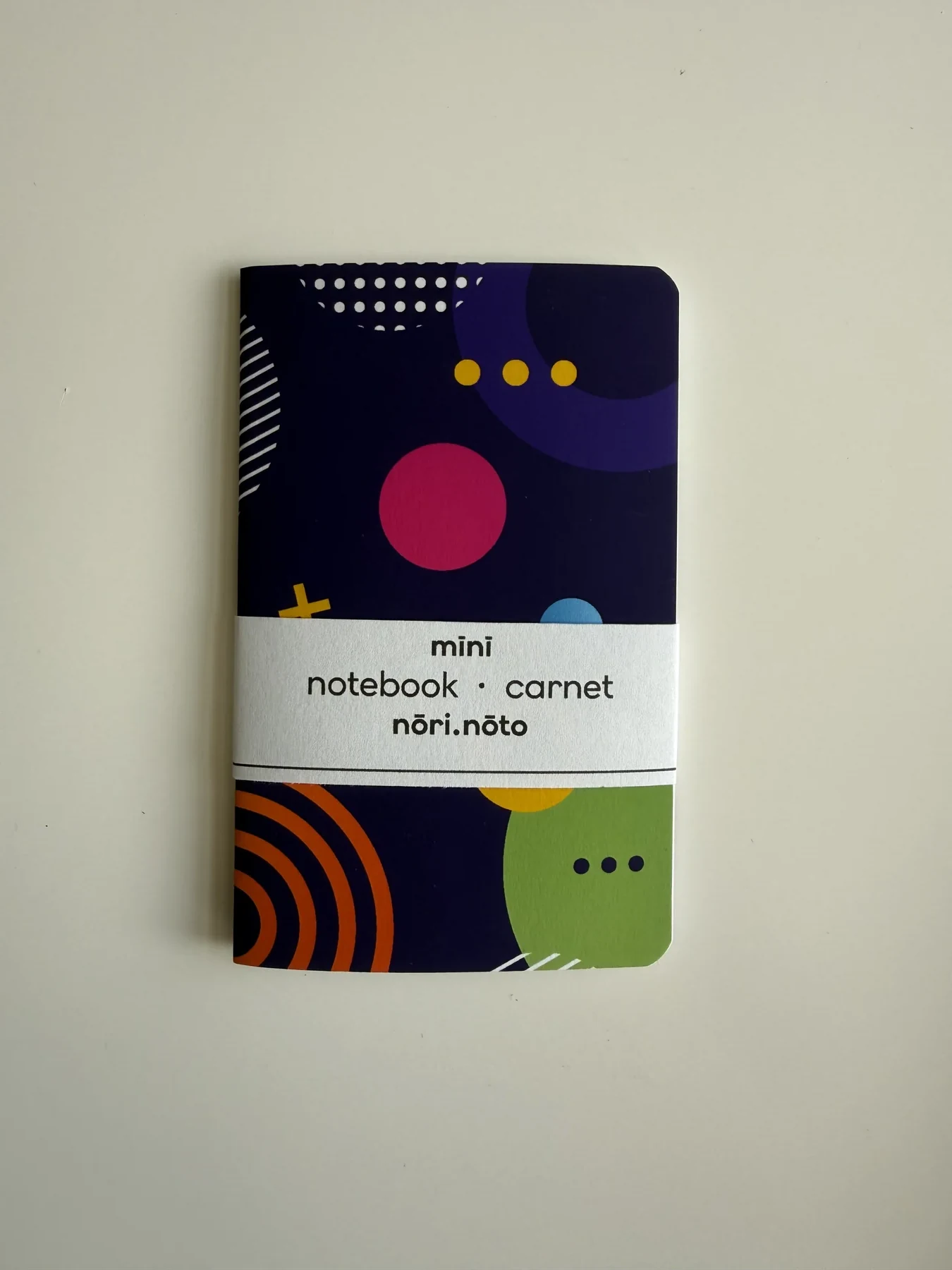 Dark Mīnī Fankī notebook with bright circles and lines