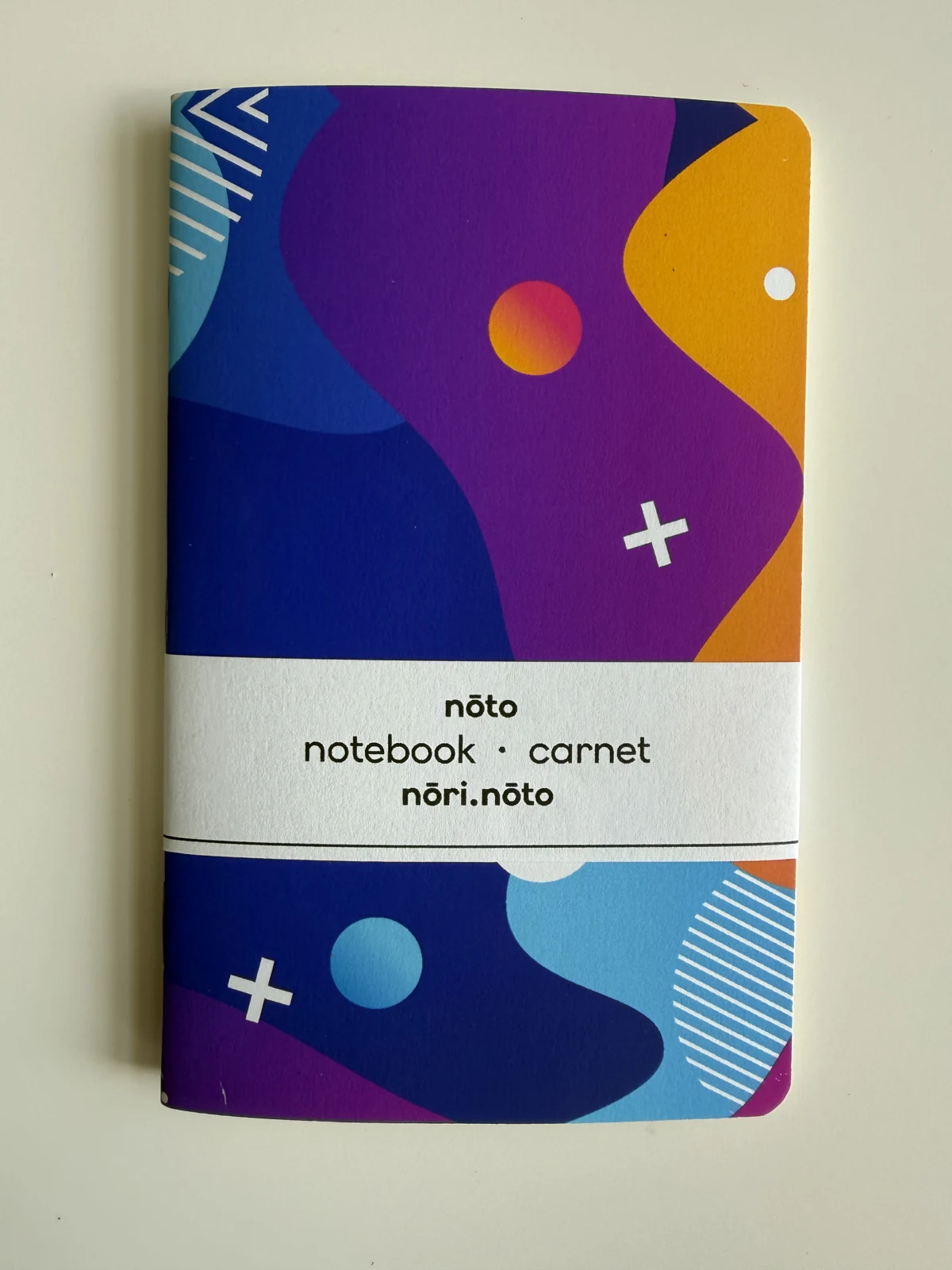 Nōto Fankī notebook with purple, orange, and blue cover
