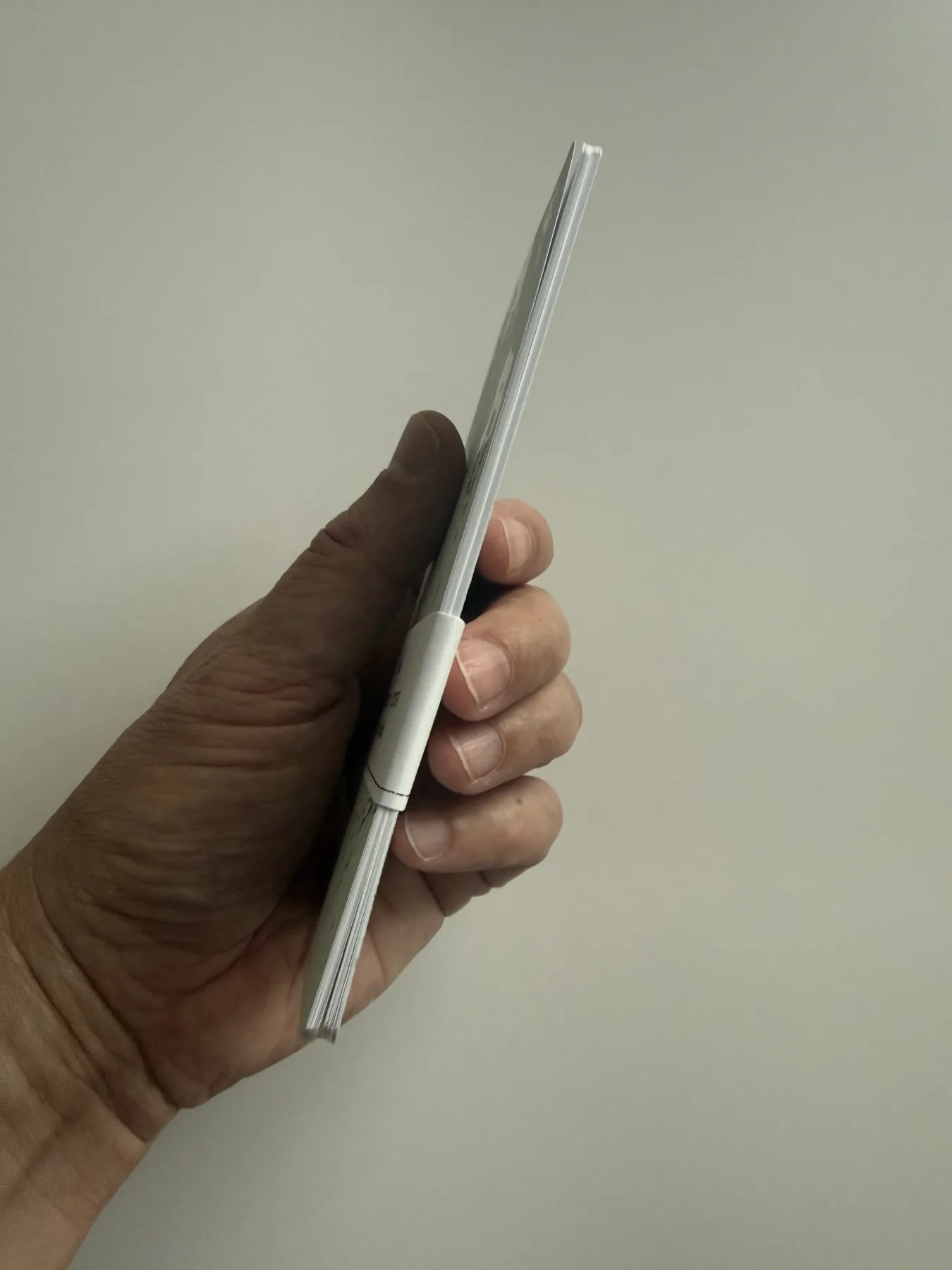 Side profile of a staple-bound Nōto notebook